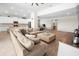 Open concept living room with kitchen and sectional sofa at 7149 Dilly Lake Ave, Groveland, FL 34736