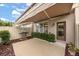 Relaxing back patio with awning, grill, and lush landscaping at 7236 Shadeview Aly, Windermere, FL 34786