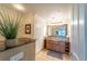 Elegant bathroom with granite vanity and large mirror at 7609 Heritage Crossing Way # 201, Reunion, FL 34747