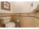 Clean bathroom with toilet and tiled floors at 7609 Heritage Crossing Way # 201, Reunion, FL 34747