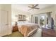 Comfortable main bedroom with plush bedding and private balcony at 7609 Heritage Crossing Way # 201, Reunion, FL 34747