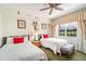 Mickey Mouse themed bedroom with twin beds, and plenty of natural light at 7609 Heritage Crossing Way # 201, Reunion, FL 34747