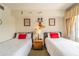 Charming bedroom with twin beds, Mickey Mouse decor, and large window at 7609 Heritage Crossing Way # 201, Reunion, FL 34747