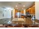 Updated kitchen featuring stainless steel appliances and granite countertops at 7609 Heritage Crossing Way # 201, Reunion, FL 34747