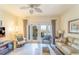 Spacious living room featuring a view and hardwood floors at 7609 Heritage Crossing Way # 201, Reunion, FL 34747