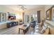 Bright living room with comfy furniture and access to a balcony at 7609 Heritage Crossing Way # 201, Reunion, FL 34747