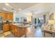 Open concept living room and kitchen with access to a balcony at 7609 Heritage Crossing Way # 201, Reunion, FL 34747