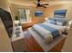 Stylized bedroom with wood floors, modern decor, and a large window, perfect for relaxation and comfort at 7839 Murcott Cir, Orlando, FL 32835