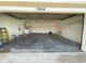 Spacious two-car garage interior offering ample storage and parking, with washer and dryer hookups for added convenience at 7839 Murcott Cir, Orlando, FL 32835