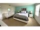 Main bedroom with king bed, crib, and tranquil decor at 840 Las Fuentes Dr, Kissimmee, FL 34746