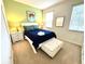 Bedroom with a blue bedspread and green accent wall at 840 Las Fuentes Dr, Kissimmee, FL 34746