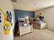 ' bedroom with twin beds and fun Minion wall art at 840 Las Fuentes Dr, Kissimmee, FL 34746