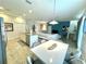 Open concept kitchen and dining area with white cabinets at 840 Las Fuentes Dr, Kissimmee, FL 34746