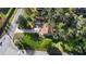 Aerial view of a single story home with a large yard and driveway at 847 Lake Charm Dr, Oviedo, FL 32765