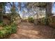 Large backyard with wooden fence and gate at 847 Lake Charm Dr, Oviedo, FL 32765