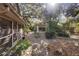 Spacious backyard with a stone patio, pergola, and shed at 847 Lake Charm Dr, Oviedo, FL 32765