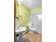 Simple bathroom with tub, toilet, and pedestal sink at 847 Lake Charm Dr, Oviedo, FL 32765