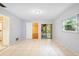 Bedroom with tiled floors and access to a patio at 847 Lake Charm Dr, Oviedo, FL 32765