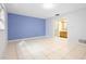 A bedroom with light purple walls and tiled floors at 847 Lake Charm Dr, Oviedo, FL 32765