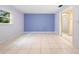 Light purple walls and tiled floors in this bedroom at 847 Lake Charm Dr, Oviedo, FL 32765