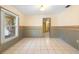 Bright dining area with striped wallpaper and tile floor at 847 Lake Charm Dr, Oviedo, FL 32765