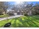 Ranch-style house with a large yard and mature trees at 847 Lake Charm Dr, Oviedo, FL 32765
