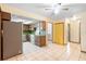 Kitchen with stainless steel refrigerator and wood cabinets at 847 Lake Charm Dr, Oviedo, FL 32765