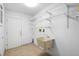 Laundry room with utility sink and ample shelving at 847 Lake Charm Dr, Oviedo, FL 32765
