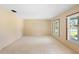 Spacious living room with light walls and carpeted floors at 847 Lake Charm Dr, Oviedo, FL 32765