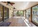 Relaxing screened porch with tile flooring and ceiling fans at 847 Lake Charm Dr, Oviedo, FL 32765