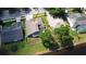 A beautiful aerial view of the house with its backyard, screened-in porch, and access to a serene pond at 890 Moonluster Dr, Casselberry, FL 32707