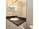 Bathroom with vanity sink and a large mirror reflecting the bright lighting at 890 Moonluster Dr, Casselberry, FL 32707