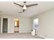 Spacious bedroom with neutral walls and trim, ceiling fan, and attached bathroom at 890 Moonluster Dr, Casselberry, FL 32707