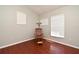 Bright bedroom featuring laminate floors, neutral paint, and base molding at 890 Moonluster Dr, Casselberry, FL 32707