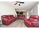 Spacious living room featuring modern flooring, neutral paint, and comfortable furniture at 890 Moonluster Dr, Casselberry, FL 32707