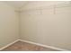Empty walk-in closet with white wire shelving and beige carpet at 890 Moonluster Dr, Casselberry, FL 32707