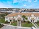 Aerial view of townhouse with front yard and community view at 9043 Dogleg Dr, Davenport, FL 33896