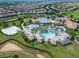 Community pool with water features and surrounding homes at 9043 Dogleg Dr, Davenport, FL 33896