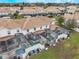 Aerial view of townhouses with private pools and screened enclosures at 9043 Dogleg Dr, Davenport, FL 33896