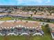 Aerial view of townhouses with private pools and screened enclosures at 9043 Dogleg Dr, Davenport, FL 33896