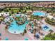 Community pool with lazy river and water features at 9043 Dogleg Dr, Davenport, FL 33896