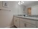 Clean bathroom with double vanity, granite countertop, and modern fixtures at 9043 Dogleg Dr, Davenport, FL 33896