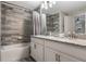 Double vanity, granite countertop, and a shower/tub at 9043 Dogleg Dr, Davenport, FL 33896