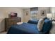 Two twin beds, wood frame, and a dresser at 9043 Dogleg Dr, Davenport, FL 33896