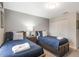 Two twin beds, wood frame, and a dresser at 9043 Dogleg Dr, Davenport, FL 33896
