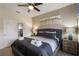 Comfortable main bedroom with king-size bed and plenty of natural light at 9043 Dogleg Dr, Davenport, FL 33896