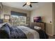Relaxing bedroom with a king-size bed, TV, and large window at 9043 Dogleg Dr, Davenport, FL 33896