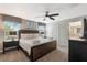 King-size bed, en-suite bathroom, and a dresser at 9043 Dogleg Dr, Davenport, FL 33896