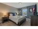 Queen bed, wood frame, and a dresser at 9043 Dogleg Dr, Davenport, FL 33896
