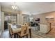 Modern dining room with glass-top table and access to backyard at 9043 Dogleg Dr, Davenport, FL 33896